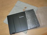 無印良品の帆布製　丸留め付きケースとノートパソコン AX3